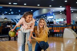 Image of mother and child bowling