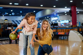 Image of mother and child bowling